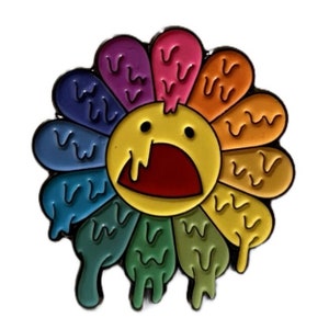 May include: A colorful enamel pin in the shape of a flower with a surprised face. The petals are various colors, including purple, pink, orange, yellow, blue, and green, with a dripping effect. The center of the flower is yellow with a red open mouth.