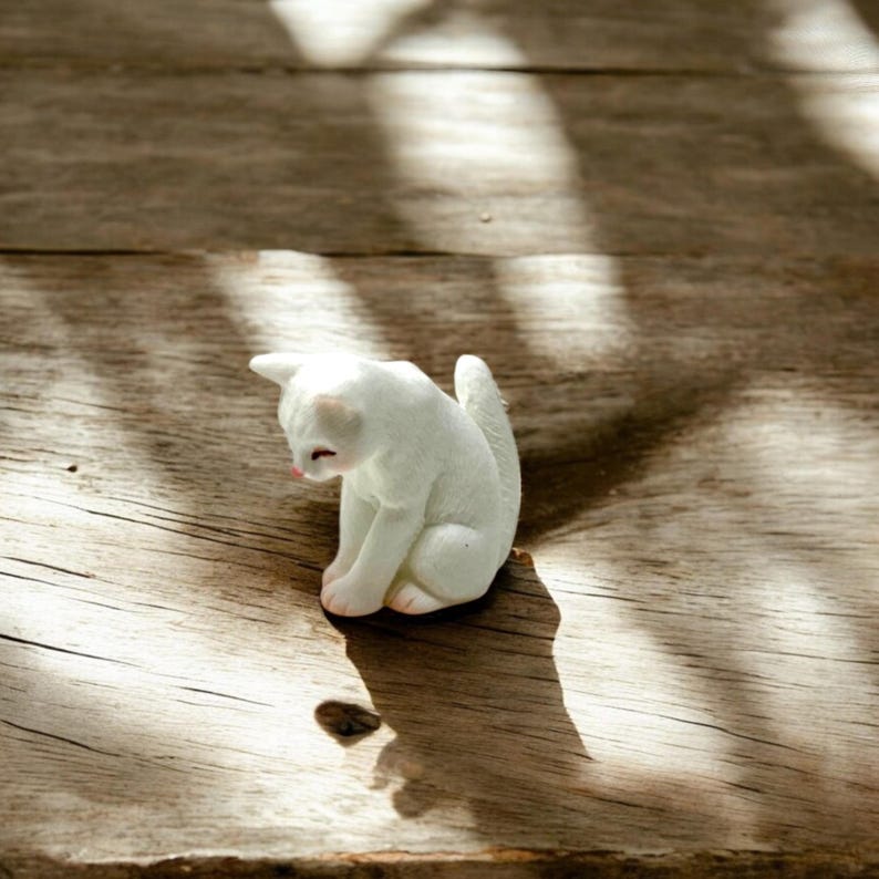 🐾 10 SEO Picture Blurbs (≤ 500 characters each)

Tiny cat figurine – the perfect addition to your fairy garden or desk décor.

Collectible kitty statue for cat lovers and miniature décor enthusiasts.

Handcrafted detail brings charm and personality to your display.

Small size makes it ideal for terrariums, dollhouses, or tiny scenes.

Unique gift for birthdays, stocking stuffers, or cat-themed presents.
