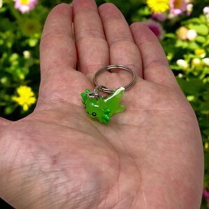Add a pop of cute energy to your everyday routine with a Mini Axolotl Keychain! Perfectly pocket-sized, this little creature is bursting with charm and makes a thoughtful addition to any bag or key set. Great for birthdays, holidays, classroom prizes, or just a little self-care treat.