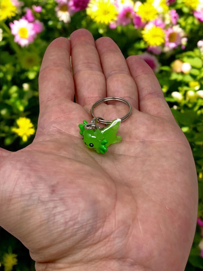 Add a pop of cute energy to your everyday routine with a Mini Axolotl Keychain! Perfectly pocket-sized, this little creature is bursting with charm and makes a thoughtful addition to any bag or key set. Great for birthdays, holidays, classroom prizes, or just a little self-care treat.