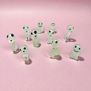 Add a touch of folklore and fantasy to your home decor with this miniature Kodama tree spirit figurine. Designed as a cute plant buddy for pots and planters, it brings whimsy and calming forest vibes to any space. Whether placed in a terrarium, fairy garden, or bookshelf, this tiny nature spirit makes a charming gift for plant parents, garden lovers, and fans of mystical home accents.