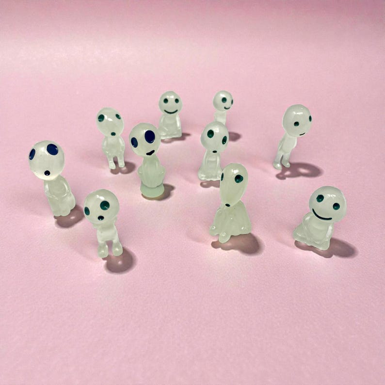 Add a touch of folklore and fantasy to your home decor with this miniature Kodama tree spirit figurine. Designed as a cute plant buddy for pots and planters, it brings whimsy and calming forest vibes to any space. Whether placed in a terrarium, fairy garden, or bookshelf, this tiny nature spirit makes a charming gift for plant parents, garden lovers, and fans of mystical home accents.