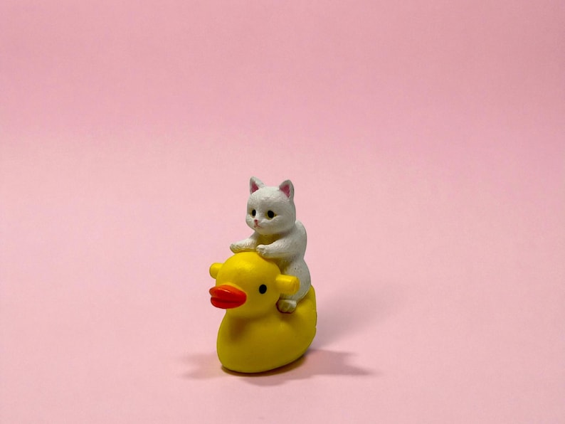 Looking for a small but unforgettable gift? This tiny cat riding duck figurine packs personality into every inch. Handmade for maximum cuteness, it makes an excellent gag gift, stocking stuffer, or unique décor piece. Perfect for cat lovers, office coworkers, or anyone who appreciates miniatures that add humor and charm to their day.