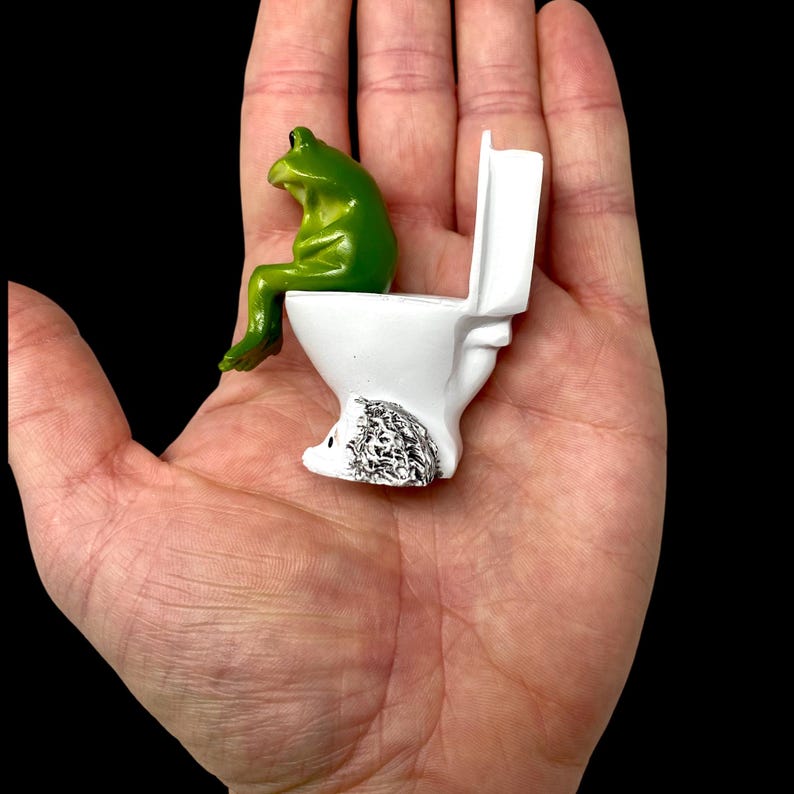 Add charm and comedy to any space with this whimsical frog on toilet figurine. This funny frog decor works perfectly as bathroom decor, shelf decor, or desk decor. A popular novelty frog statue and gag gift that frog lovers and humor fans instantly adore.
