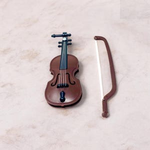 Add a dose of humor to life’s smallest problems with this tiny violin gag gift. Designed for laughs, it’s a clever desk accessory and a guaranteed conversation starter. Compact and easy to carry, it’s perfect for prank moments, office jokes, or gifting to someone who appreciates dry wit. A great choice for stocking stuffers, white elephant parties, and novelty gift lovers who enjoy a good laugh.