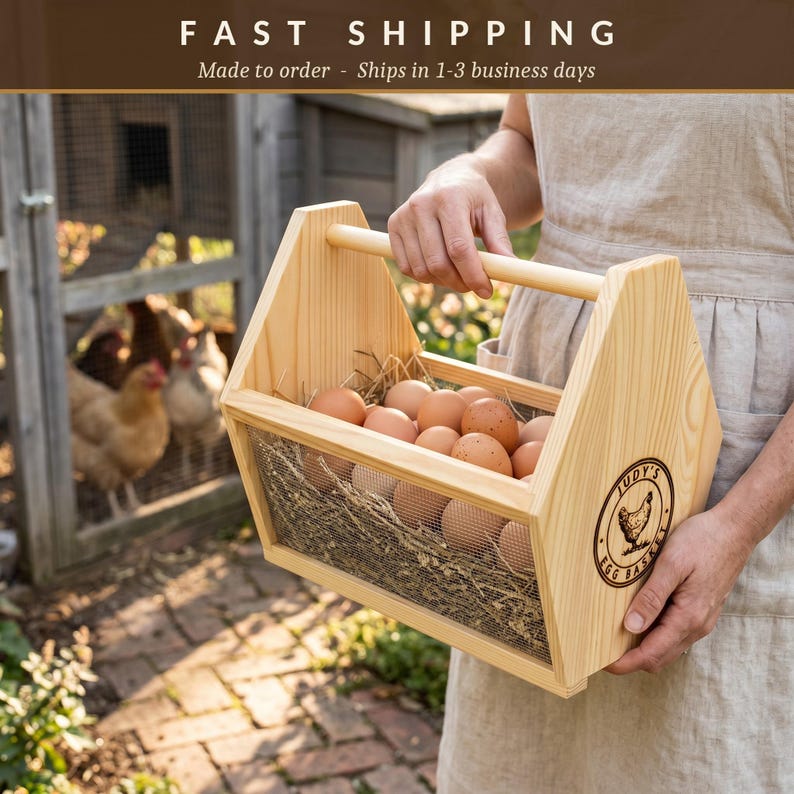 A fast shipping banner notes each basket is made to order and ships in 1 to 3 business days, above a lifestyle photo of the engraved basket brimming with eggs. This personalized egg collection basket is a handmade farmhouse egg gathering basket, a solid pine wood egg and produce basket with breathable metal mesh sides, a smooth sanded dowel carry handle, and a laser engraved front panel, about 12 inches long, 7.5 inches wide and 10 inches tall. A custom chicken egg basket, engraved egg...