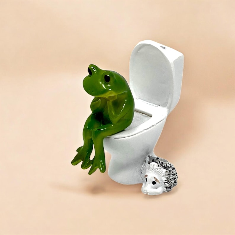 This funny frog figurine sitting on a toilet is the ultimate novelty decor piece. Perfect for bathrooms, desks, and gift baskets, it’s a silly frog gift that never fails to entertain. Ideal for gag gifts, stocking stuffers, and whimsical home decor lovers.