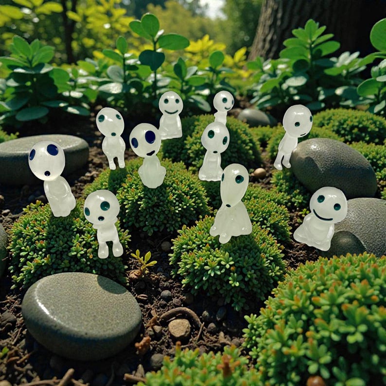 This cute Kodama plant companion transforms any indoor plant into a magical forest display. Inspired by nature spirits from Japanese folklore, it adds charm, whimsy, and peaceful energy to your decor. Perfect for fairy gardens, desks, and plant shelves, this miniature figurine makes a wonderful gift for plant lovers, gardeners, and fantasy decor fans.
