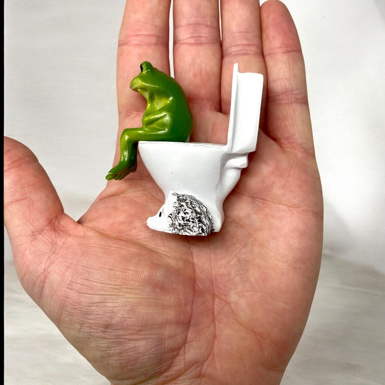 This silly frog toilet figurine is designed for maximum laughs. Whether used as bathroom decor, desk decor, or shelf styling, it’s a unique novelty frog statue that stands out. Makes a perfect gag gift, funny gift, or whimsical home accent for frog lovers of all ages.
