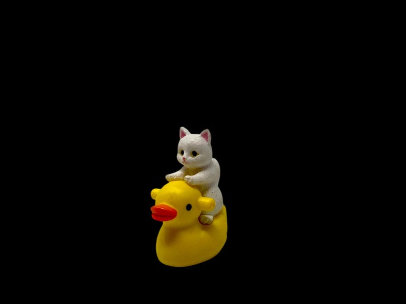 This cat riding duck figurine is the ultimate quirky gift for holidays, birthdays, and everyday surprises. Its tiny handmade design makes it perfect for stocking stuffers, funny gifts, and miniature collections. Cat lovers appreciate its cute character, while humor-seekers love its ridiculous charm. A guaranteed smile-maker wherever it’s displayed.
