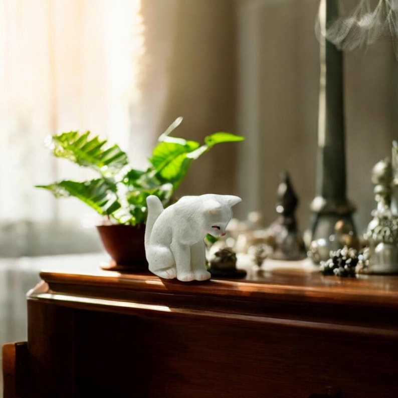 High-quality materials for lasting durability and cuteness.

Makes whimsical desk décor for home or office.

Perfect for collectors of animal miniatures and figurines.

A thoughtful, affordable gift for any cat lover.

Create a magical touch in fairy gardens and indoor plants.