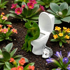 This silly frog on toilet figurine combines cute design with hilarious bathroom humor. A standout piece of novelty frog decor, it’s ideal for gifting, collecting, or displaying. Perfect for frog lovers, funny gift seekers, and anyone who enjoys whimsical home accents.