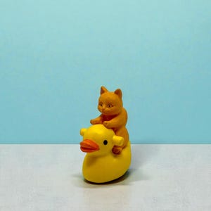 This cat riding duck mini figurine brings pure whimsy to any room. A perfect stocking stuffer or gag gift, it’s crafted to deliver smiles the moment it’s unboxed. Cat lovers adore its silly charm, while collectors love its unique design. Ideal for holiday gifting, office pranks, and anyone who loves quirky, joyful mini decorations.