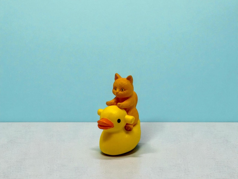This cat riding duck mini figurine brings pure whimsy to any room. A perfect stocking stuffer or gag gift, it’s crafted to deliver smiles the moment it’s unboxed. Cat lovers adore its silly charm, while collectors love its unique design. Ideal for holiday gifting, office pranks, and anyone who loves quirky, joyful mini decorations.