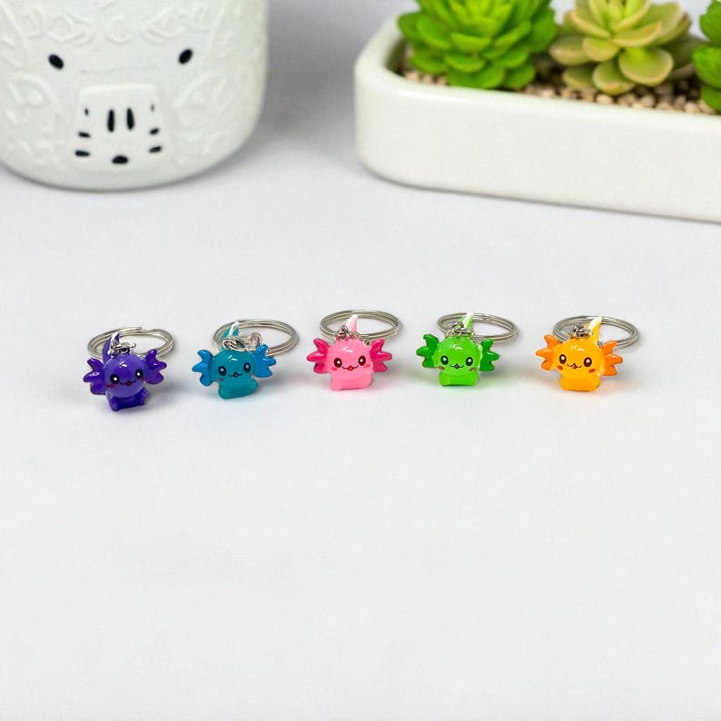 Say hello to your new tiny travel buddy—the Mini Axolotl Keychain! Each piece is crafted with delightful detail, making it an adorable accent for your keys, handbag, or car mirror. Makes a charming small gift for birthdays, holidays, or as a token of appreciation for someone who loves cute things!