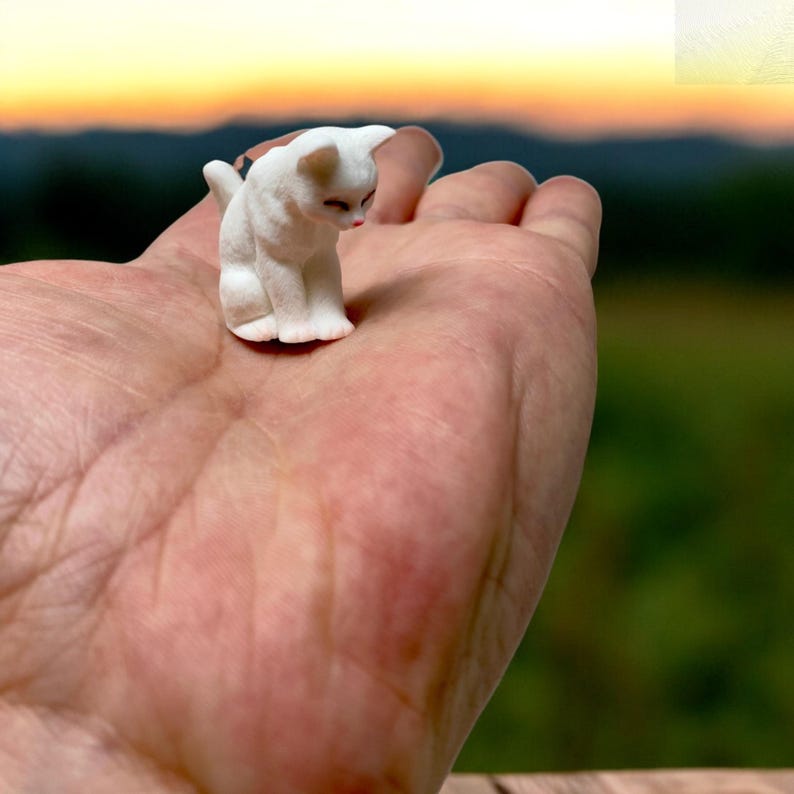 Tiny cat figurine – the perfect addition to your fairy garden or desk décor.

Collectible kitty statue for cat lovers and miniature décor enthusiasts.