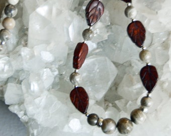 Petoskey stone beaded necklace with red jasper leaves and mixed fossils