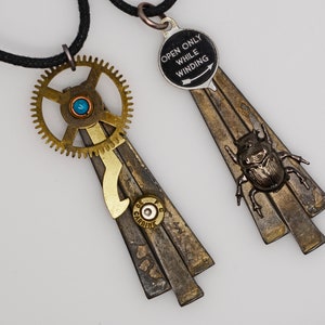 2 Steampunk mixed metal antique square nails pendant necklaces scarab beetle insect camera dial  and gear and bullet artist created