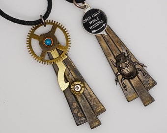 2 Steampunk mixed metal antique square nails pendant necklaces scarab beetle insect camera dial  and gear and bullet artist created