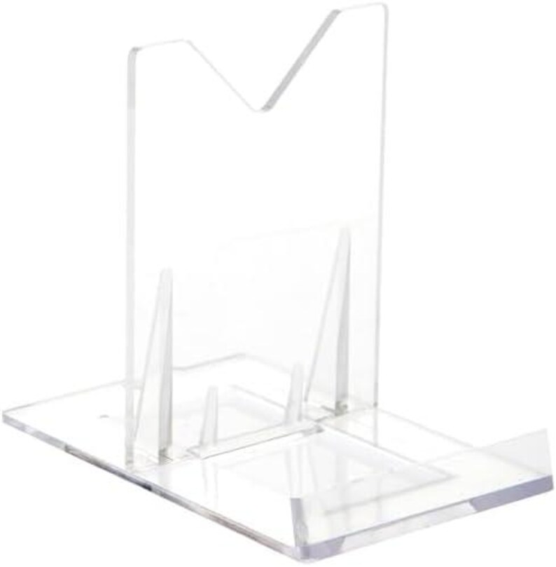 May include: Clear plastic stand for displaying items. The stand has a V-shaped back and a flat base.