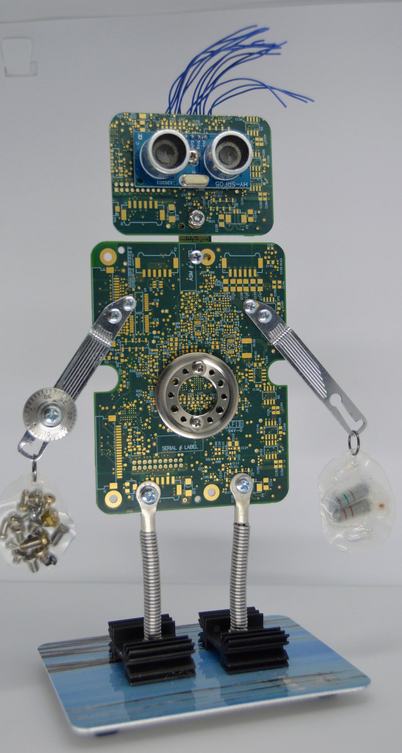robot art figure made from recycled materials industrial techi image 0