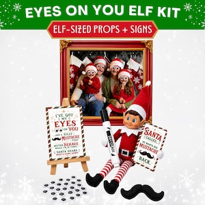 May include: An Eyes On You Elf Kit featuring a red and white elf doll holding a dry erase marker and a sign that reads Santa Called He Wants His Mustache Back. Includes a sign on a wooden easel, googly eyes, and a black mustache prop.