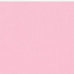 May include: A solid pink Kona Cotton fabric swatch. The fabric is a light pink color and has a smooth texture. The text "rkK001-189 BABY PINK" is printed at the bottom of the swatch.