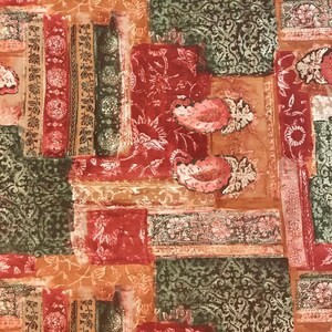 May include: A fabric with a patchwork design featuring various floral patterns in shades of red, green, and brown. The fabric has a vintage, distressed look.