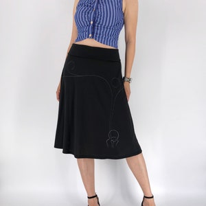 Black jersey knit skirt with white modern line drawing and swirling sewing stitch lines, A-line midi black skirt in size S and M image 1