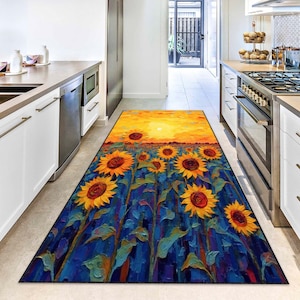 May include: A rectangular kitchen rug featuring a vibrant sunflower field under a sunset sky. The rug's design includes large yellow sunflowers with brown centers against a blue background, creating a colorful and artistic floor covering.