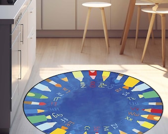 May include: A round blue rug featuring colorful pencils arranged around the perimeter. The rug has the alphabet written around the edge. The pencils are in various colors, including red, yellow, and green.