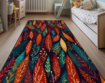 May include: A rectangular area rug with a colorful leaf design. The rug features a dark navy blue background with large, stylized leaves in shades of red, orange, teal, and gold. The leaves have intricate vein details.
