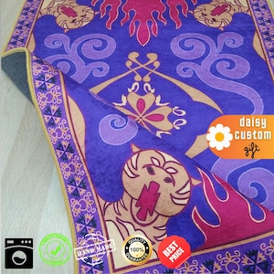 May include: A rolled-up purple rug with a detailed design featuring a tiger, swirls, and floral patterns. The rug has a gold border and a gray backing. The rug has the text "daisy custom gift".