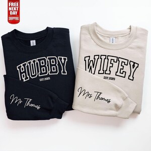 Personalized Couples,
Mr and Mrs sweater,
Matching Sweatshirts,
Custom sweaters,
Bridal Shower Gift,
Newlywed Present,
Wedding Gift,
Couples Apparel,
His and Hers,
Engagement Gift,
Anniversary Gift,
Custom Couple,
Wifey Hubby jumpers,