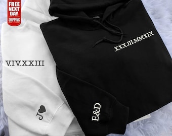 May include: Two hoodies, one white and one black. The white hoodie has the Roman numeral V.I.V.XXXIII and a heart with a J on the sleeve. The black hoodie has the Roman numeral XXX.III.MMXIX on the front and E&D on the sleeve.
