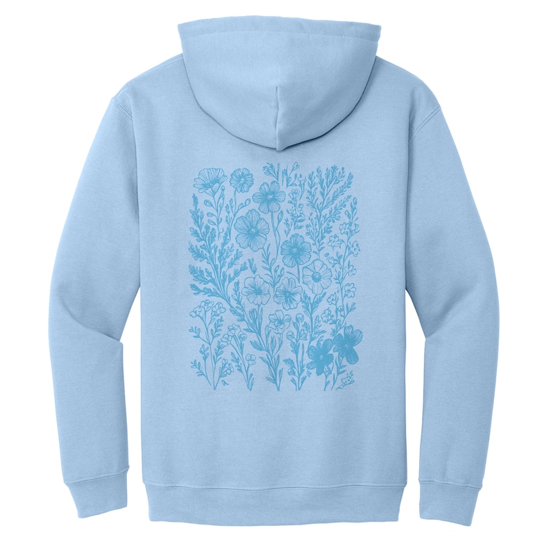 May include: A light blue hoodie with a floral design printed on the back. The design features a variety of flowers and leaves in a light blue color.