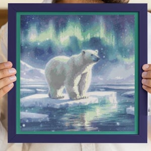 May include: A framed diamond painting showing a polar bear standing on a frozen lake beneath a vivid green and blue aurora borealis.