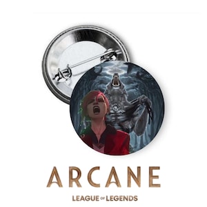 May include: A round button featuring a character from the Arcane League of Legends series. The character is a young woman with red hair and a red jacket, standing in front of a large wolf with glowing eyes. The background is a dark forest with a full moon.