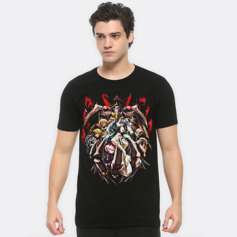 May include: Black t-shirt with a graphic print of a group of anime characters in a fighting pose. The characters are surrounded by red and black flames.