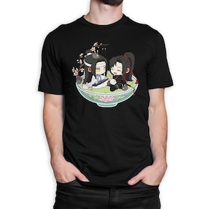 May include: Black t-shirt with a cartoon image of two anime characters in a bowl with a green background. The characters are holding a white rabbit.