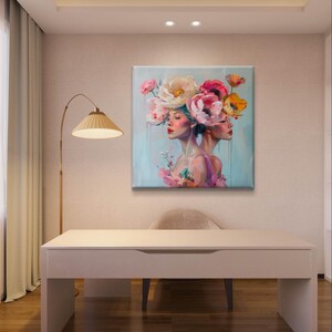 Puede incluir: Una pintura de dos mujeres con sus cabezas entrelazadas, llevando una corona de flores coloridas. El fondo es azul claro con un toque de verde.