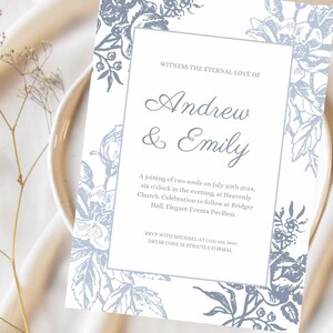 Könnte beinhalten: Eine weiße Hochzeitseinladung mit einem blauen floralen Rand. Der Text lautet "Erleben Sie die ewige Liebe von Andrew & Emily. Eine Vereinigung zweier Seelen am 20. Juli 2024, 18 Uhr, in der Heavenly Church. Die Feier findet anschließend im Bridger Hall, Elegant Events Pavilion, statt. RSVP bei Michael unter (123) 456 7890. Dresscode ist streng formell."