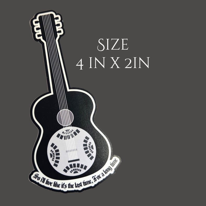 May include: A black and white guitar-shaped sticker with the text "So I'll live like it's the last time, For a long time." The sticker measures 4 inches by 2 inches.