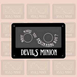 May include: Black cassette tape with white text that reads "What makes you fascinating boy?" and "Devils Minion".