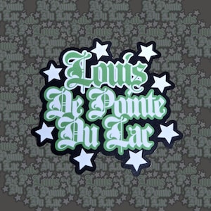 May include: A sticker with the text "Louis De Pointe Du Lac" in a stylized font, outlined in black and green. White stars surround the text on a black background. The background is a repeating pattern of the same text and stars.