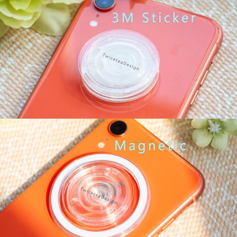 Może przedstawiać: Dwa zdjęcia telefonu z przezroczystym, okrągłym uchwytem na telefon. G&oacute;rne zdjęcie przedstawia naklejkę 3M, a dolne zdjęcie uchwyt magnetyczny. Tekst "TwiceteaDesign" jest widoczny na uchwycie.