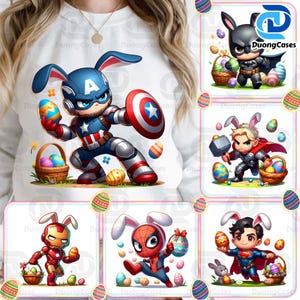 May include: White sweatshirt featuring a Captain America-themed bunny holding an Easter egg and shield. Other designs include superhero bunnies: Batman, Thor, Iron Man, Spider-Man, and Superman. Easter basket and egg graphics are also present.