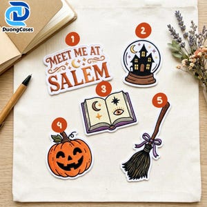 May include: Five embroidered patches featuring Halloween themes: a text patch reading Meet Me At Salem, a crystal ball with a haunted house, an open spellbook with celestial symbols, a smiling jack-o'-lantern, and a broomstick with a purple bow.