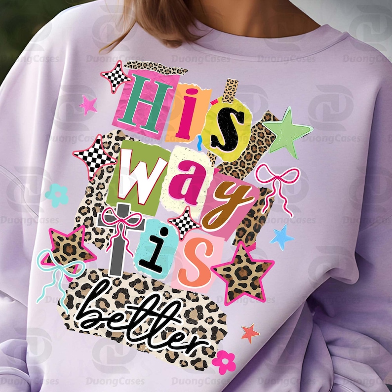 May include: A light purple sweatshirt with the text "His way is better" in a collage style. The design includes leopard print, stars, and a cross, with a variety of colors including pink, green, and yellow.