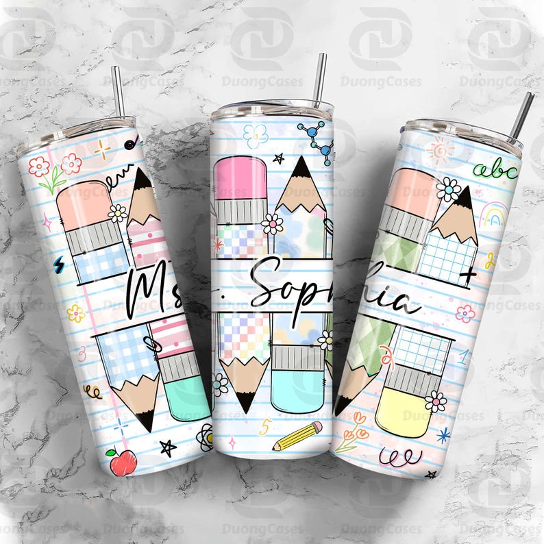 May include: Three personalized tumblers with a school theme. Each tumbler features a pencil and eraser design, with the name "Sophia" and "Ms." written on them. The tumblers are decorated with flowers, stars, and other school-related graphics.